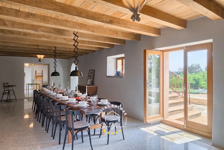Large dining area with an outdoor view in villa