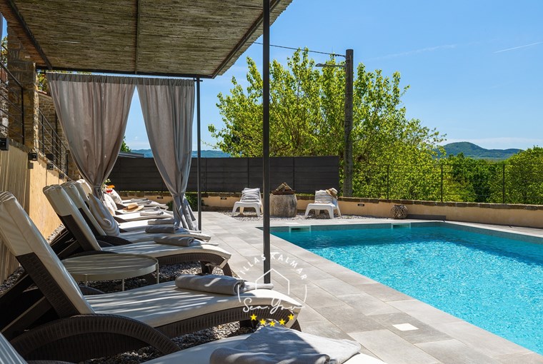 Sunloungers by the private pool of villa near Motovun