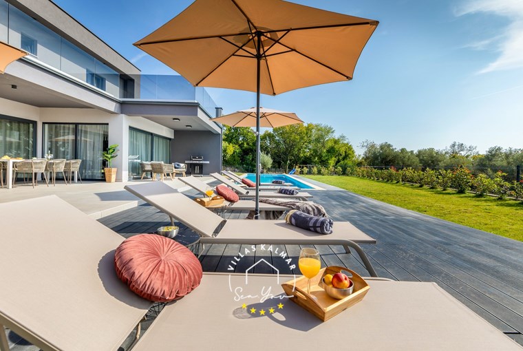 Pool area with sun loungers