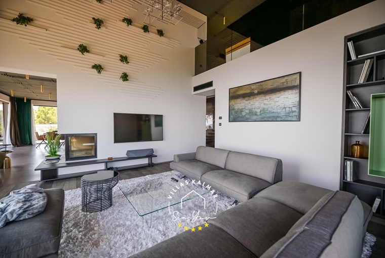 Modern open-plan living area connected to terrace – luxury villa Croatia
