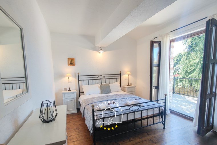 Modern bedroom with balcony in villa