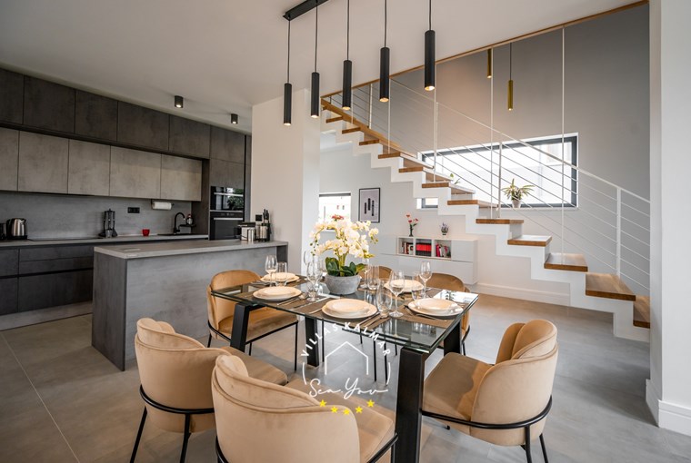 Modern dining area and kitchen in villa