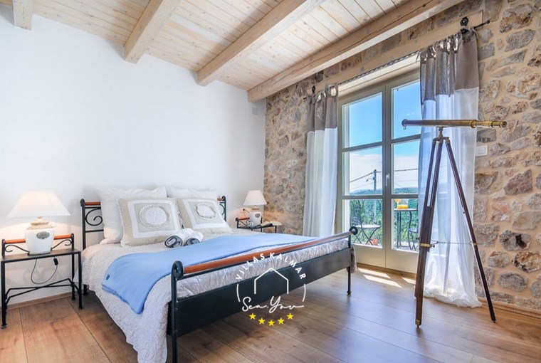 Elegant bedroom with balcony and countryside views – Villa Amore