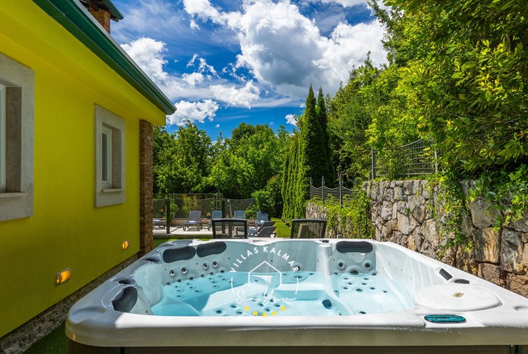 Outdoor hot tub overlooking the pool area surrounded by lush greenery - Villa Angeli near Opatija