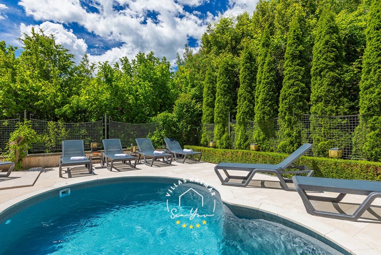 Comfortable sun loungers by the pool surrounded by nature - Villa Angeli near Opatija
