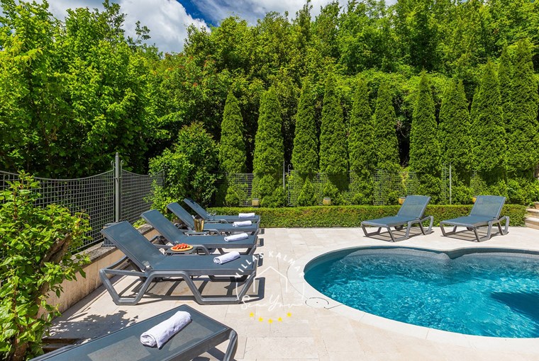 Comfortable sun loungers by the pool surrounded by nature - Villa Angeli near Opatija