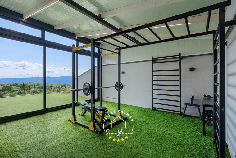 Gym room with glass wall and view over the Kvarner Bay in Villa Lavinia in Opatija