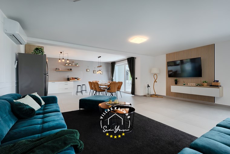 Luxurious open space living area with kitchen and dining area in Villa Lavinia in Opatija