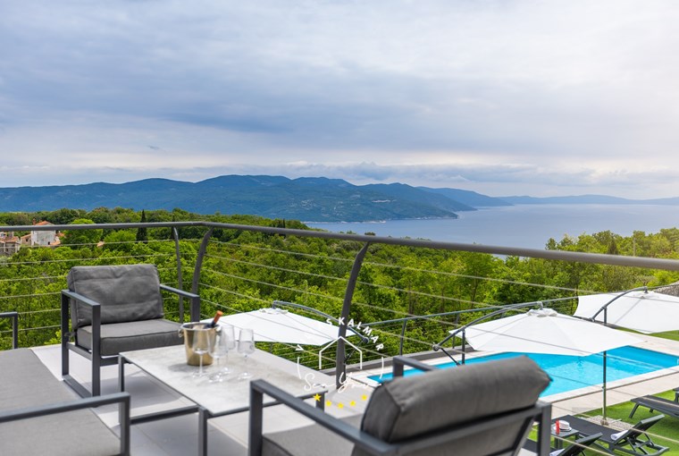 Seating area on the terrace with stunning sea view overlooking the pool area - Villa Lavinia near Opatija