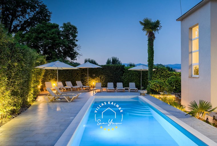 Private outdoor pool with sun loungers and plants - Villa Lovran