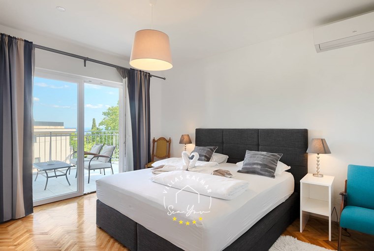 Airy bedroom with double bed and balcony in beautiful Villa Lovran in Lovran