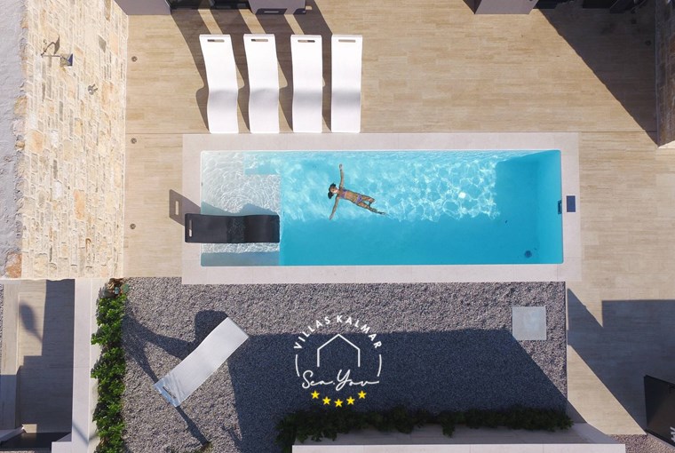 Private pool and sun loungers in luxurious villa K1 on the Island of Pasman