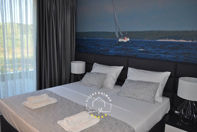 Comfotrable bedroom with double bed in Villa K2 on the beautiful island of Pasman