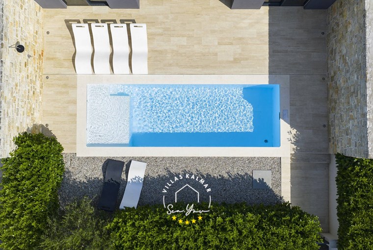 Private pool with sun loungers and plants in luxurious Villa K2 on Pasman