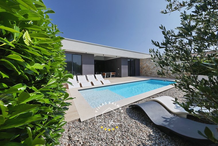 Relaxing pool area at modern Villa K3 near the Adriatic Sea in Croatia