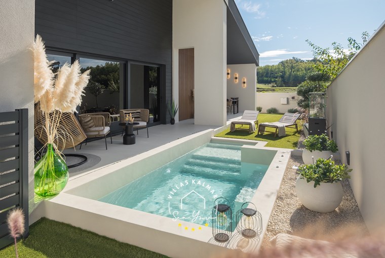 Villa Amoreta – private outdoor heated pool surrounded by Mediterranean garden