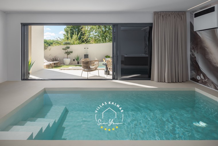 Indoor heated pool inside the private wellness area of Villa Amoreta