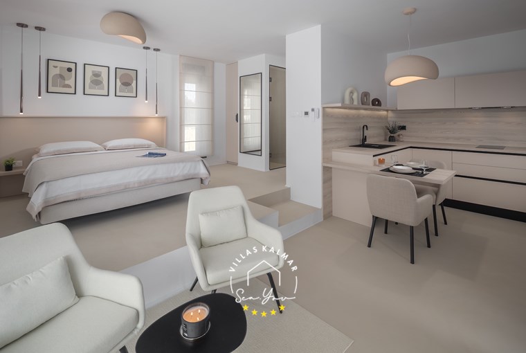 Open-plan living room with warm ambient lighting at Villa Amoreta in Labin-Rabac