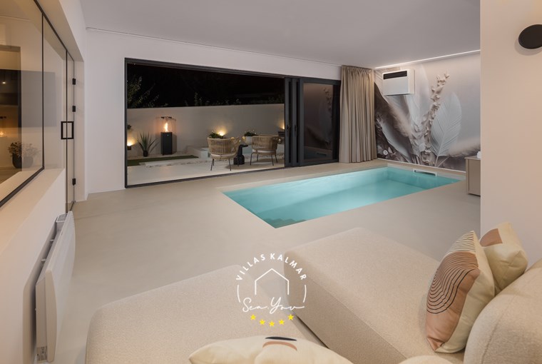 Designer spa space with indoor pool, jacuzzi and relaxation setting