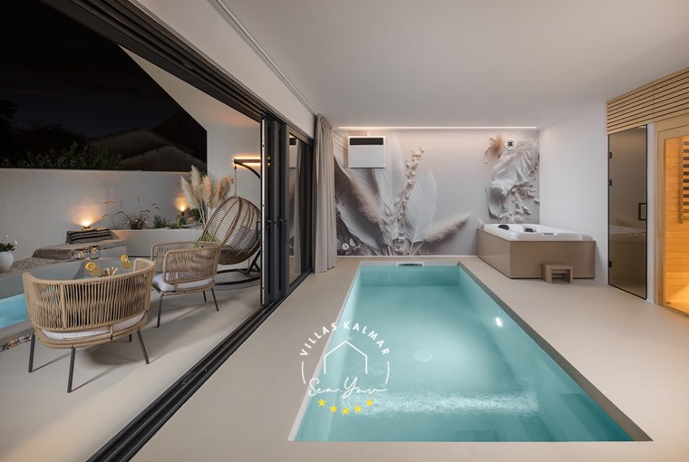 Luxury indoor jacuzzi with spa lighting – Villa Amoreta wellness zone