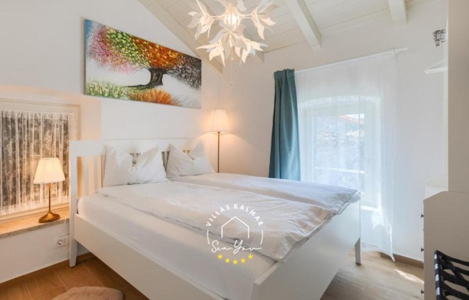 Comfortable, airy bedroom with double bed in Villa Andrea in Central Istria