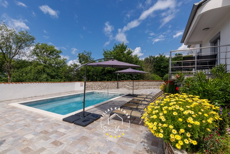 Private pool and garden with yellow flowers in Villa Modern Hosue Ana, Crikvenica