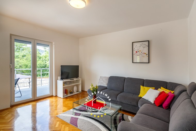 Living area with TV and balcony doors in Villa Modern House Ana near Crikvenica