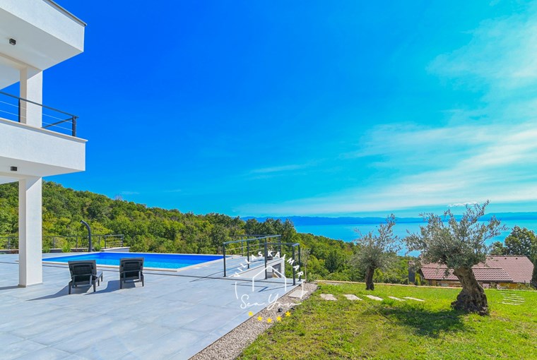 Outdoor area of modern Villa Ziganto near Opatija with garden, private pool and gorgeous sea view