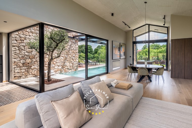 Villa livingroom and dining area with glass windows near Rovinj