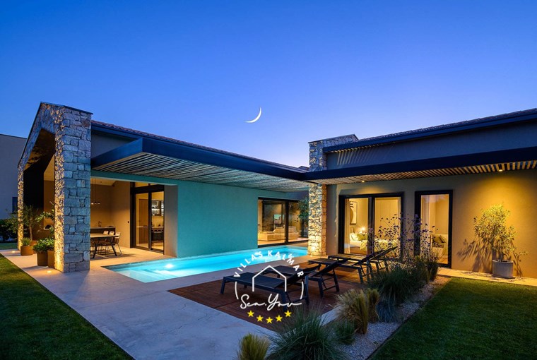 Villa CasaNova in Bale with private pool and sun loungers at night