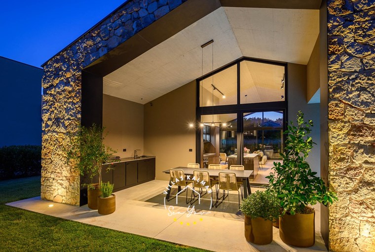 Outdoor dining area next to pool in Villa CasaNova close to Rovinj